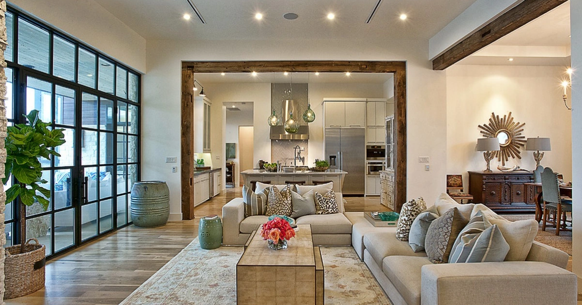 Luxury living room showcasing interior design and styling trends with natural materials, layered lighting, and custom details.